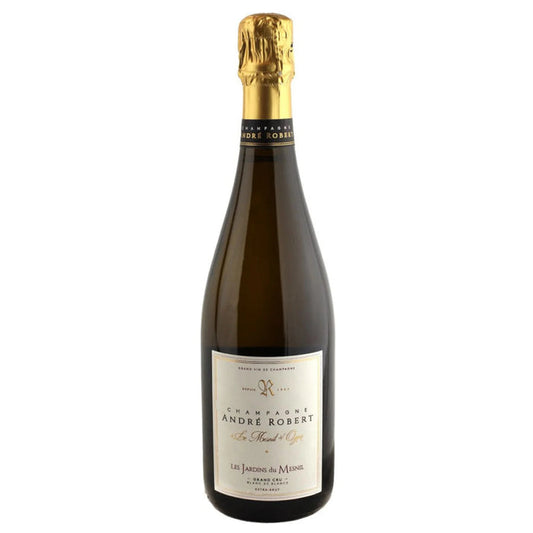 Champagne bottle with gold foil top and white label