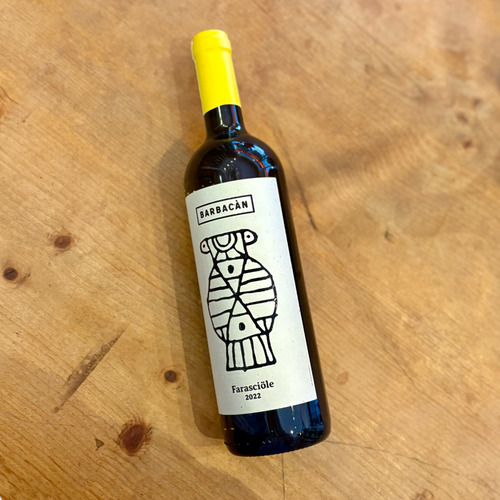 White wine bottle with yellow cap, Barbacan label and illustrated figure, 2022 front