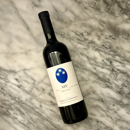 Carpineti Nzu Red 2020 wine bottle tilted, blue Nzu label