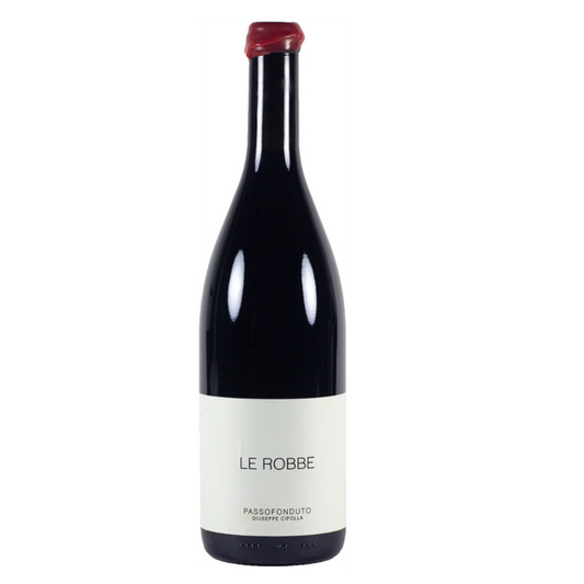 Red wine bottle with burgundy glass and white label reading LE ROBBE