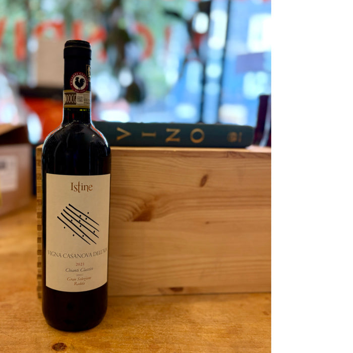 Red wine bottle with Istine label and dark glass