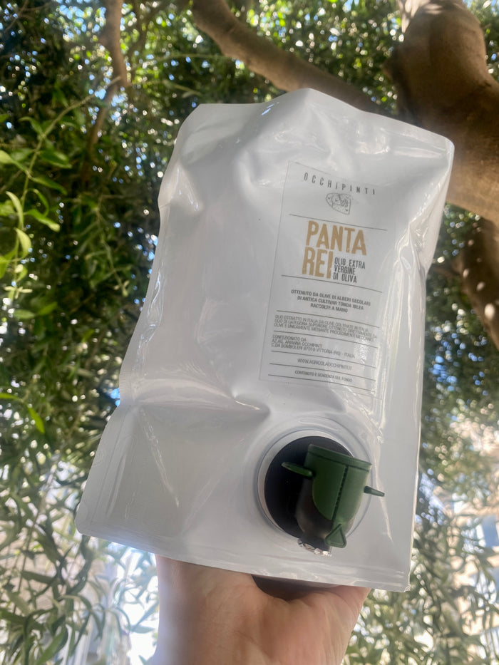 White extra virgin olive oil pouch with front label and green spout cap